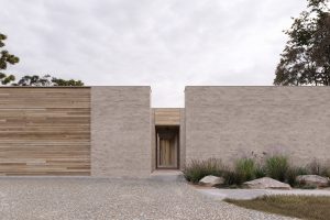 External wall made of stone brick and mixed-tone timber with gateway inside yard — sustainable new home — Eltham — Moloney Architects