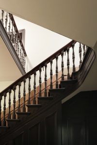Warm timber staircase with dark wooden handrail from floor — heritage restoration — Ballarat — Moloney Architects